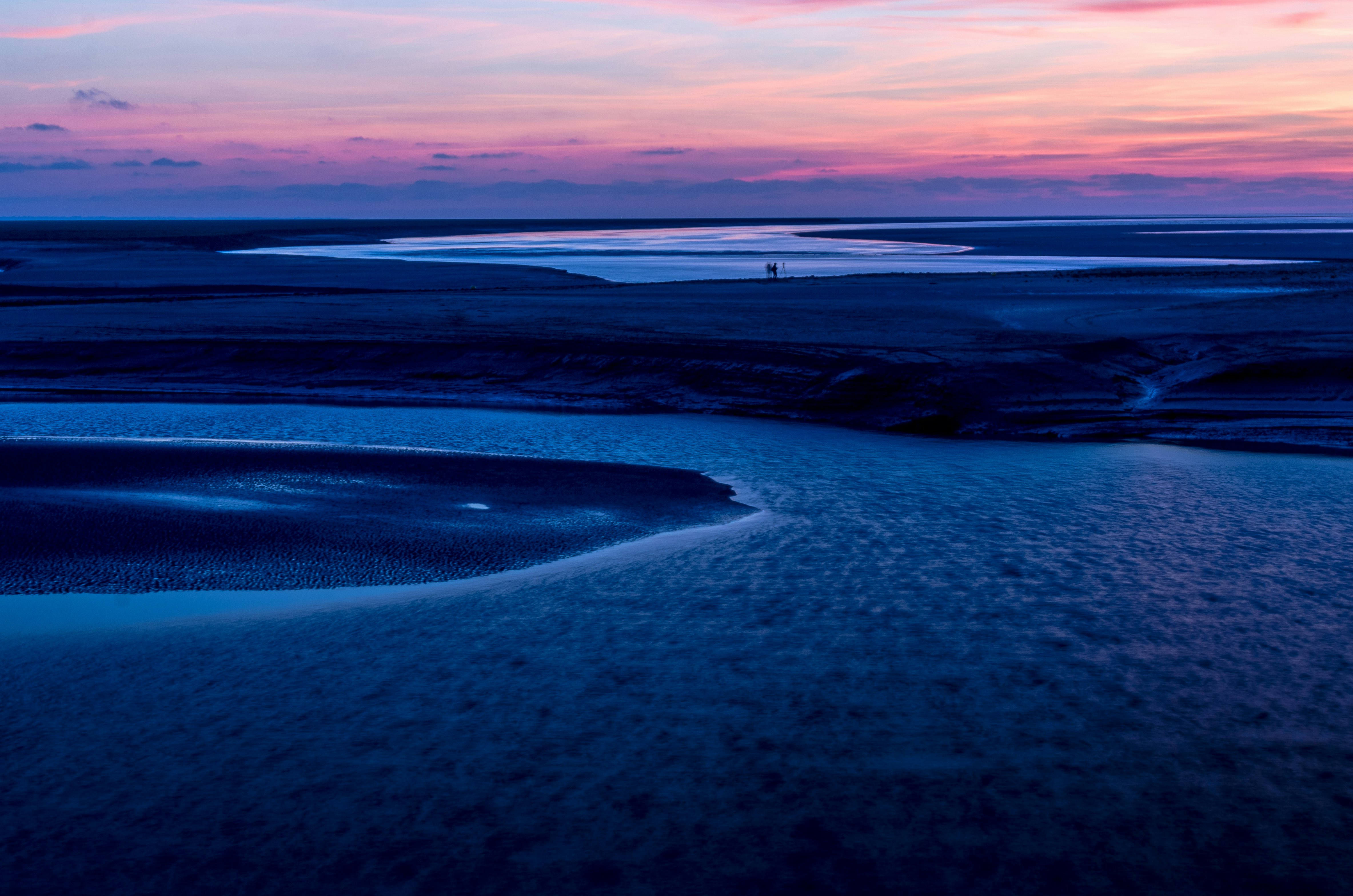 dune near on body of water